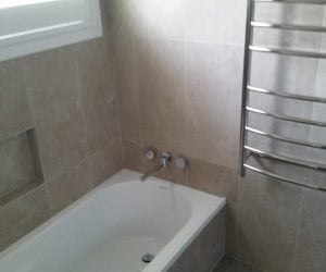 bathroom renovation - bathtub and new tiling newcastle